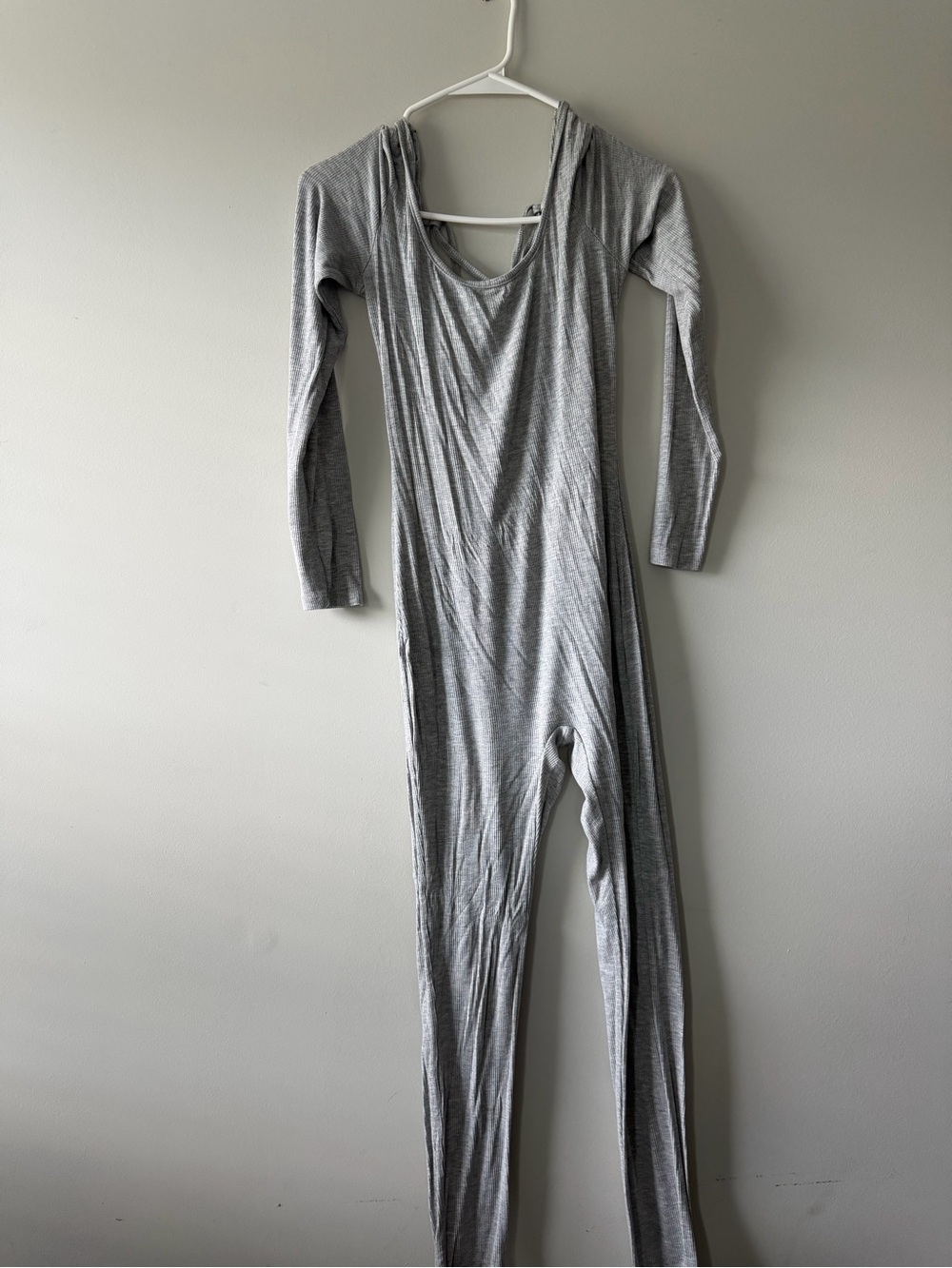 Long-Sleeve Gray Jumpsuit Hugs Body